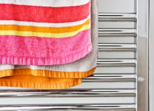 hanging wet clothes on towel warmers
